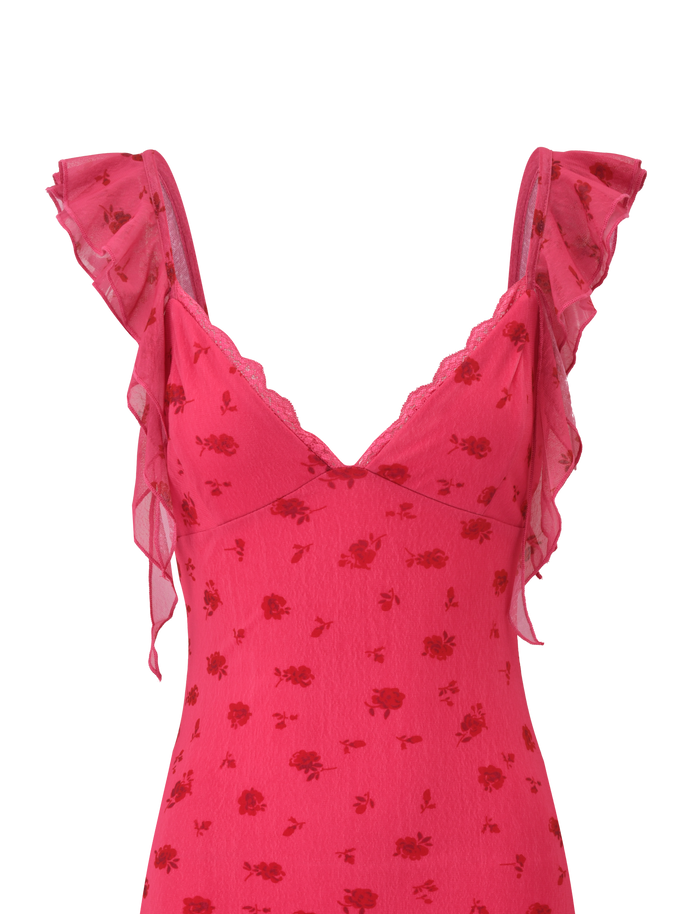 The TIGERMIST AMARIS MINI DRESS - DITSY FLORAL features a sleeveless pink V-neck design with delicate lace trim, flutter ruffle straps, and a charming red rose pattern on soft printed mesh.