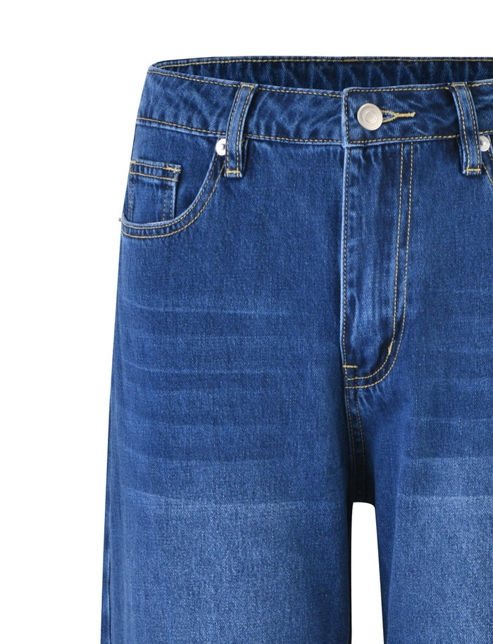 Close-up view of the TIGERMIST AVEREE JEAN - BLUE : DARK WASH showcasing front pockets, belt loops, contrasting stitching, and a button closure. The fabric features a slightly faded look around the thigh area.