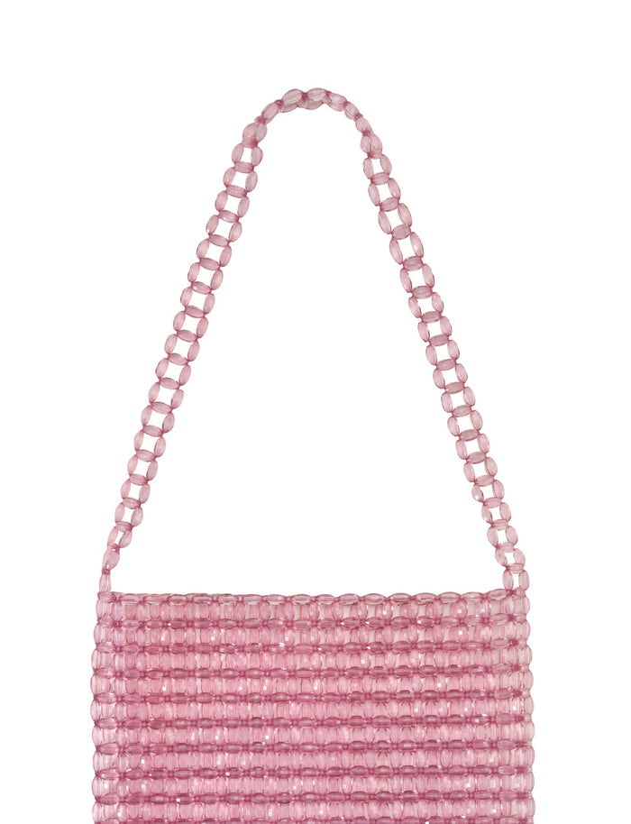 The BIANKA BAG by TIGERMIST features pink clear lucite beads in horizontal rows, creating a textured look. This stylish accessory includes a matching shoulder strap to enhance its elegance.