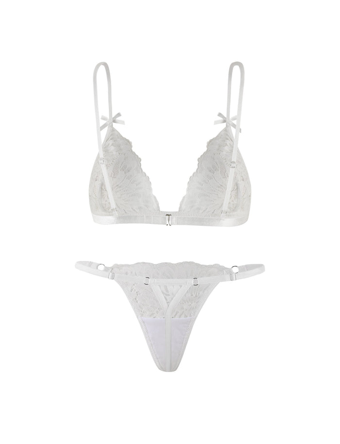 Introducing the TIGERMIST BROOKE SET - WHITE: a sheer lace intimate set featuring a white bralette with adjustable shoulder straps and a clasp closure at the back, paired with a matching thong adorned with delicate lace detailing and thin side straps.