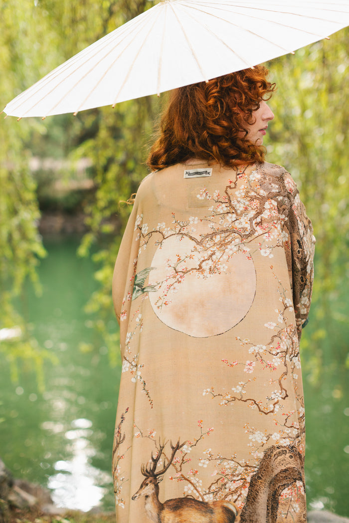 Model wearing Fable Goddess Duster featuring antique Japanese art, cherry and peach blossoms, nightingales, deer, and French block prints - Market of Stars