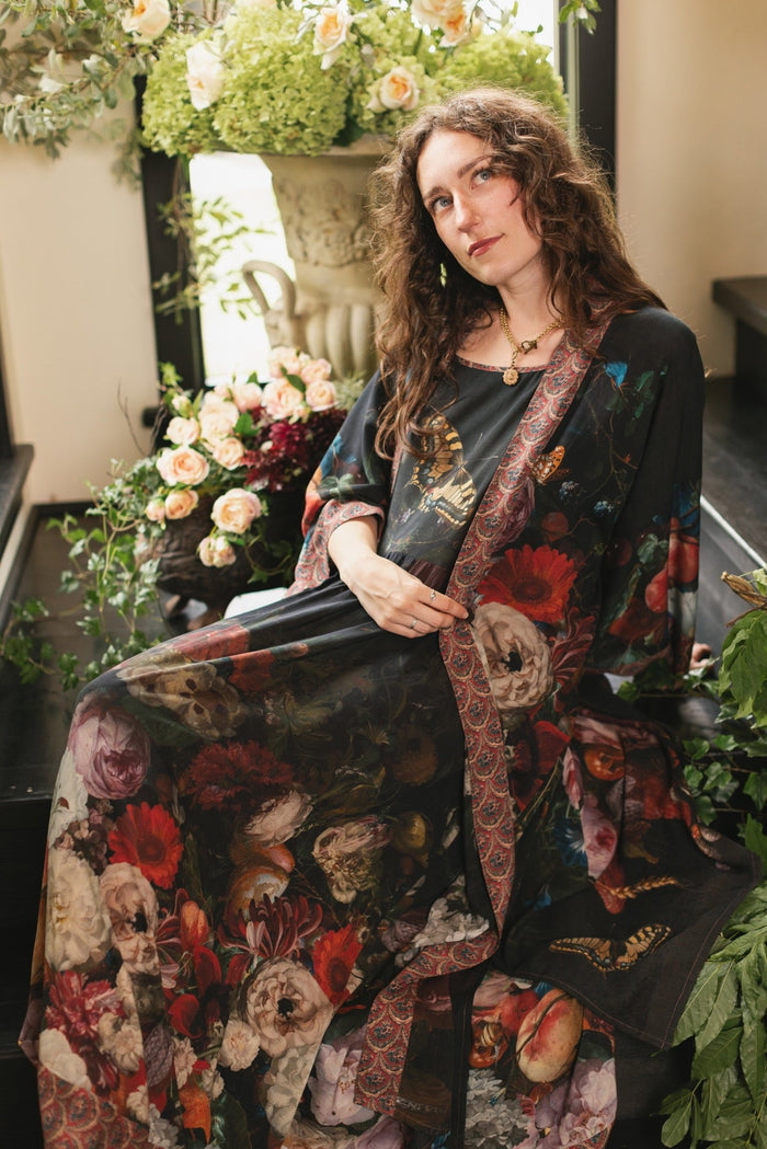 Model wearing Flight of Fancy Bohéme Slip Dress featuring hummingbirds and a vibrant floral bouquet inspired by 1700s still-life paintings by Rachel Ruysch – Market of Stars.