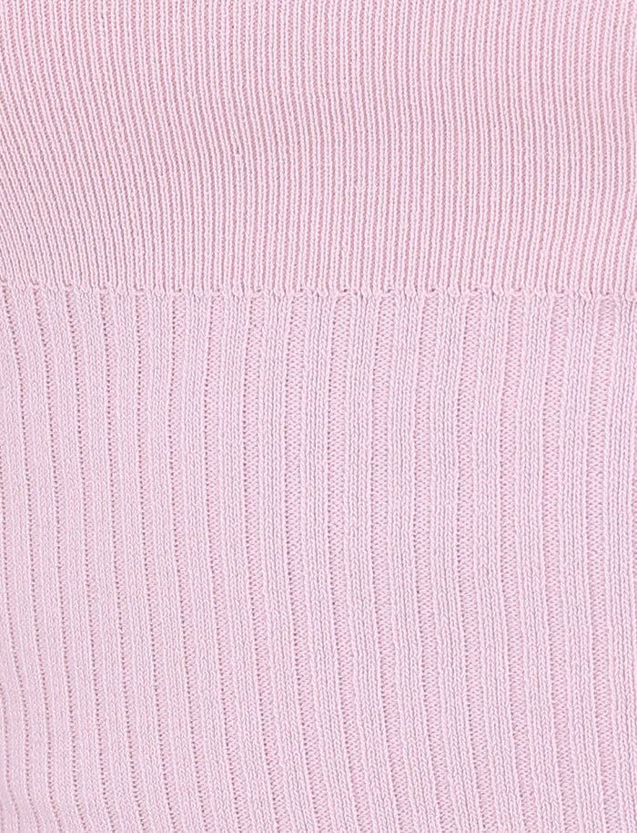 Close-up of the TIGERMIST GREER DRESS in BABY PINK, featuring a vertical ribbed knit fabric that is ideal for a mini dress. The texture, with its distinct ridge and groove design, creates a soft and tactile appearance that complements the tie shoulder straps beautifully.