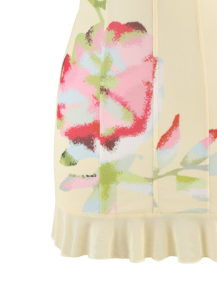 The HOLLIS DRESS by TIGERMIST, a light yellow corset dress featuring a femme floral print, boasts a vibrant blend of pink, red, and green tones. This mini dress highlights vertical seams and an enchanting ruffled hem, making it perfect for making a statement.