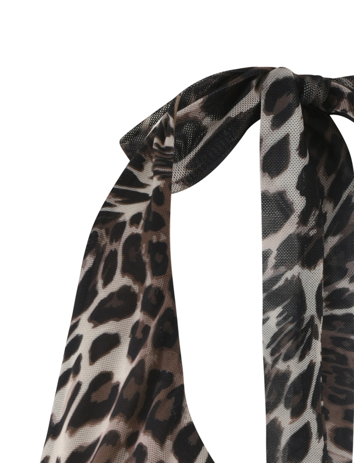 Close-up of the TIGERMIST PEARL TOP - MULTI : LEOPARD, featuring a tied bow and high-stretch leopard print fabric against a white background.