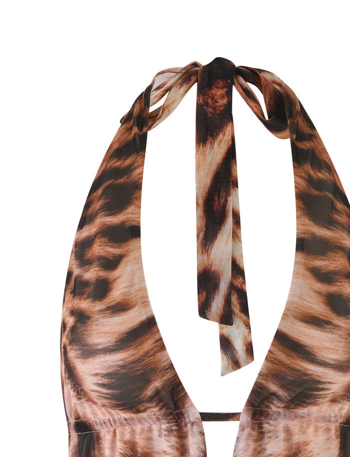 A close-up of the PEARL TOP - NEUTRAL : LEOPARD : LEOPARD HAZE by TIGERMIST, exhibiting its stunning leopard colorway. This halter bikini top features rich brown and black patterns, elegantly tying at the neck with matching straps to capture the essence of wild beauty.