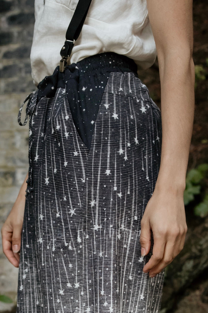 Model wearing Peace, Wine & Sunshine Bohéme Slip Dress featuring botanical collages and playful peace, wine and sunshine lettering on the hem – Market of Stars.