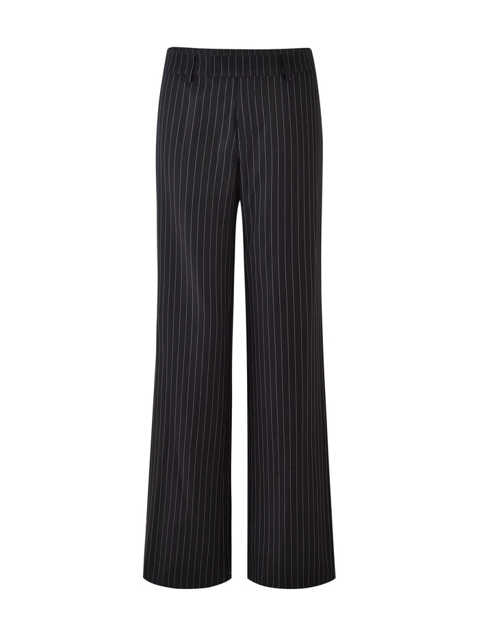 A pair of TIGERMIST TAMARA PANT - BLACK: PINSTRIPE trousers with a mid-rise waist and straight-leg design, featuring evenly spaced vertical white stripes running from the waist to the hem. These sleek pinstripe suit pants are perfect for professional or formal settings.