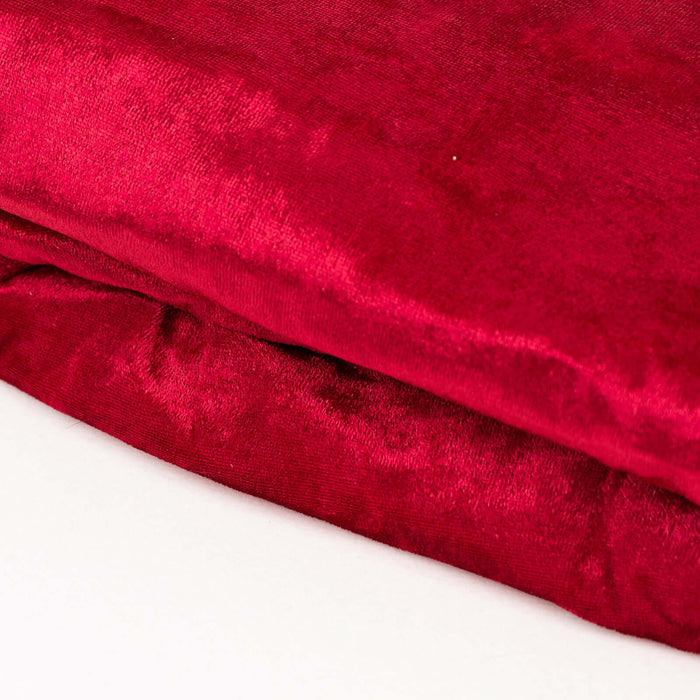 Luxurious red velvet fabric folded neatly.