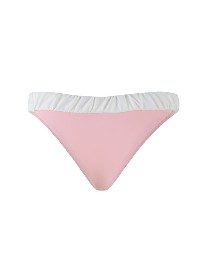 Introducing the TIGERMIST AMARAN BIKINI BOTTOM in PASTEL PINK, featuring a playful design with a light pink front and a contrasting white waistband, beautifully showcased against a white background.