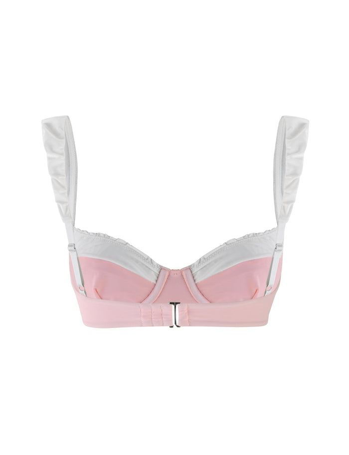 The AMARAN BIKINI TOP in pastel pink from TIGERMIST features wide straps and a front clasp, showcased against a simple white background for a sleek and stylish bodycon silhouette.