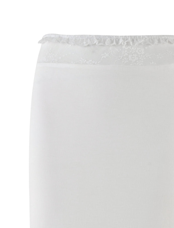 The BENTON SKIRT - WHITE by TIGERMIST features a white fabric with a delicate floral lace trim along the top edge, hinting at a refined lace waistband. The material has a smooth and slightly fitted appearance, suggesting elegance and sophistication. Set against a plain white background, this garment exemplifies simplicity and style in its design.
