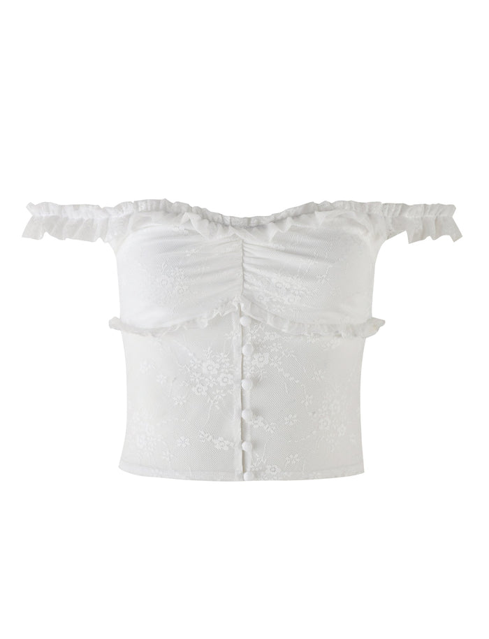 The BENTON TOP - WHITE by TIGERMIST is an off-the-shoulder crop top featuring ruffled short sleeves, button detailing down the front, and a subtle floral pattern. The fabric has a delicate and semi-sheer texture, resembling a sheer mesh bodice that adds a romantic and feminine touch to the garment.