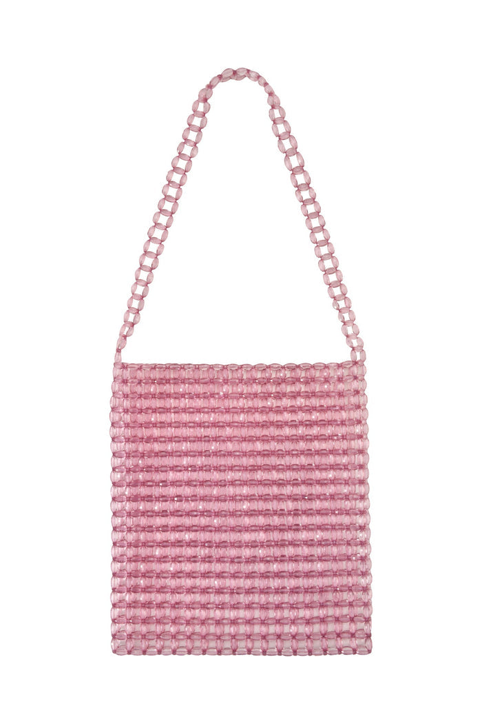 The BIANKA BAG - PINK from TIGERMIST features a rectangular design with clear lucite beads and a matching shoulder strap, offering a stylish and textured look.
