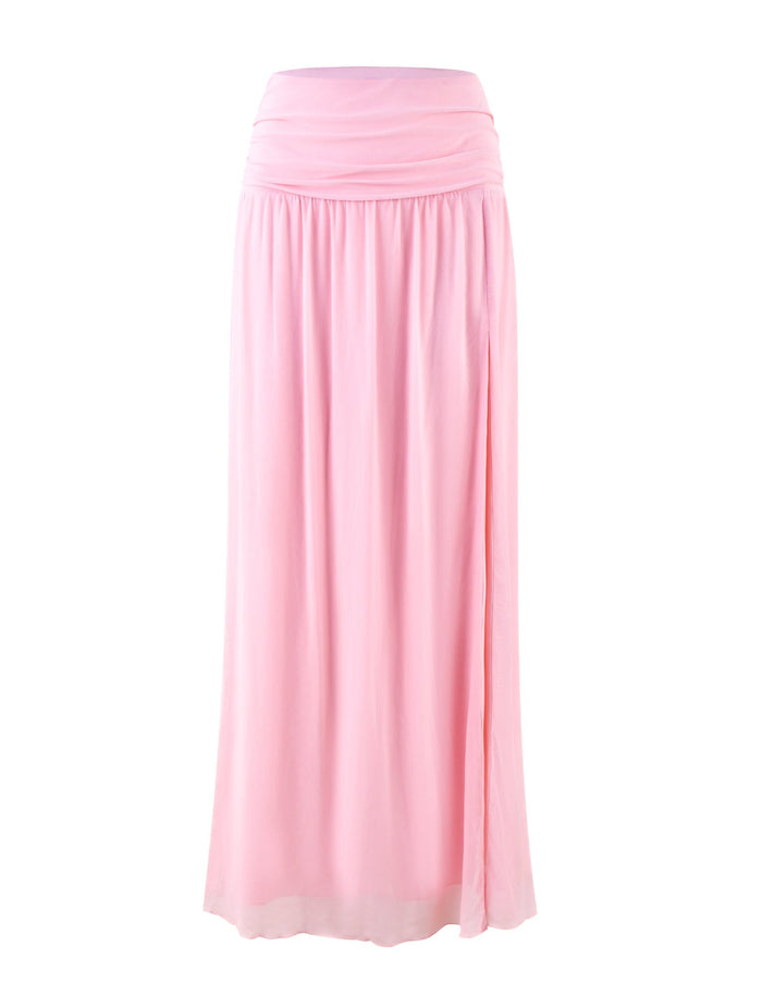 Introducing the TIGERMIST BIRDEE SKIRT in Baby Pink: a high-waisted maxi skirt with a gathered waistband and a flowing, full-length design. The lightweight fabric drapes elegantly, creating a soft and feminine look.