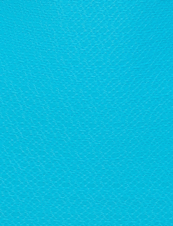 A bright blue textured surface resembling synthetic leather with a fine, consistent grain pattern. The vibrant color and texture give it a distinct, visually appealing appearance, reminiscent of the bold designs found in TIGERMIST's BOBBIE DRESS - BLUE.