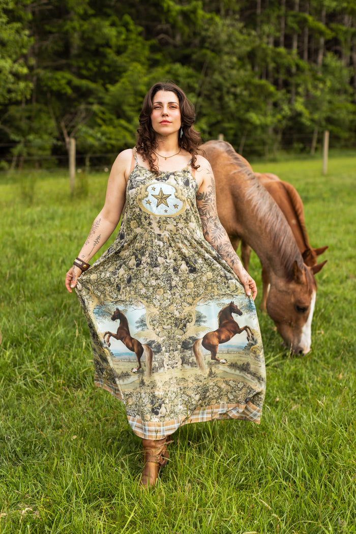 Model wearing a bamboo-viscose maxi-length slip dress made for everyday adventures with a whimsical print celebrating one's unbridled spirit of adventure - Market of Stars
