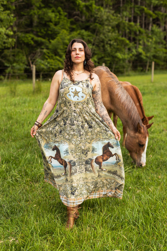 Model wearing a bamboo-viscose maxi-length slip dress made for everyday adventures with a whimsical print celebrating one's unbridled spirit of adventure - Market of Stars