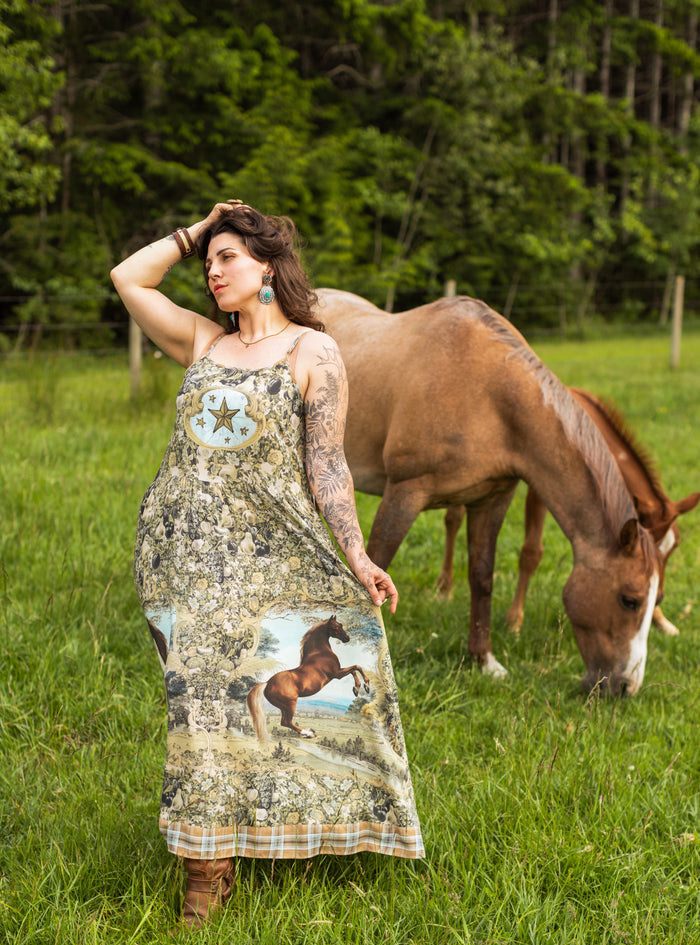 Model wearing a bamboo-viscose maxi-length slip dress made for everyday adventures with a whimsical print celebrating one's unbridled spirit of adventure - Market of Stars