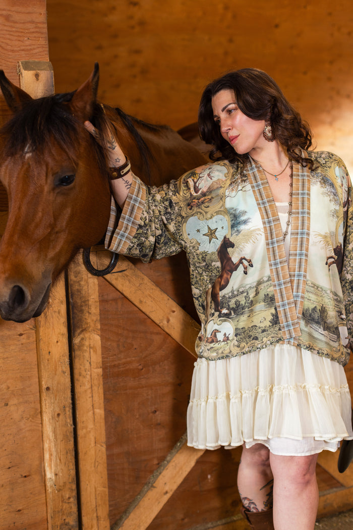 Model wearing a bamboo-viscose cropped kimono duster made for everyday adventures with a whimsical print celebrating one's unbridled spirit of adventure - Market of Stars