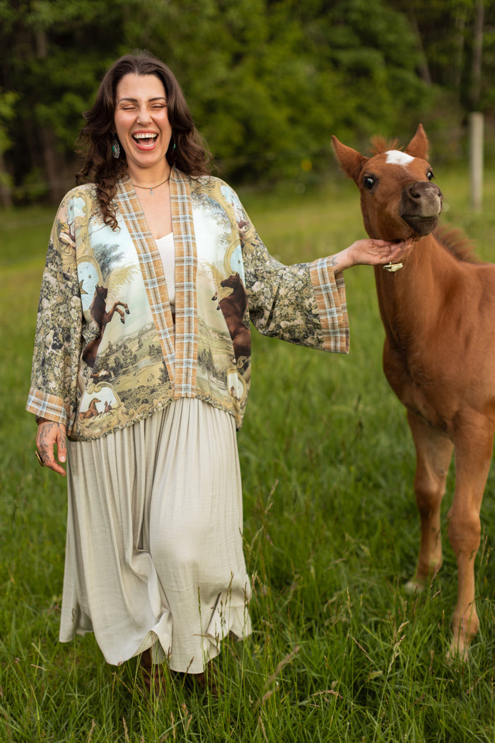 Model wearing a bamboo-viscose cropped kimono duster made for everyday adventures with a whimsical print celebrating one's unbridled spirit of adventure - Market of Stars
