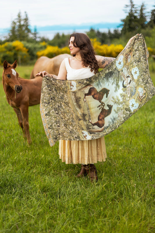 Model wearing a bamboo-viscose scarf made for everyday adventures with a whimsical print celebrating one's unbridled spirit of adventure - Market of Stars