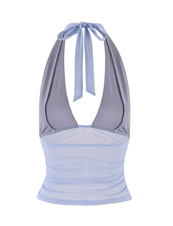 The TIGERMIST BRESILY TOP in Steel Blue features a sophisticated halter design with a tie at the neck. Its sheer, striped pattern and backless style bring an elegant touch to this chic piece.