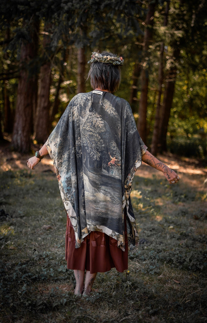 Castles in the Air Starduster kimono featuring Brueghel’s 1600s landscape, classical ruins, and joyful swing scene on bamboo-based viscose – Market of Stars.