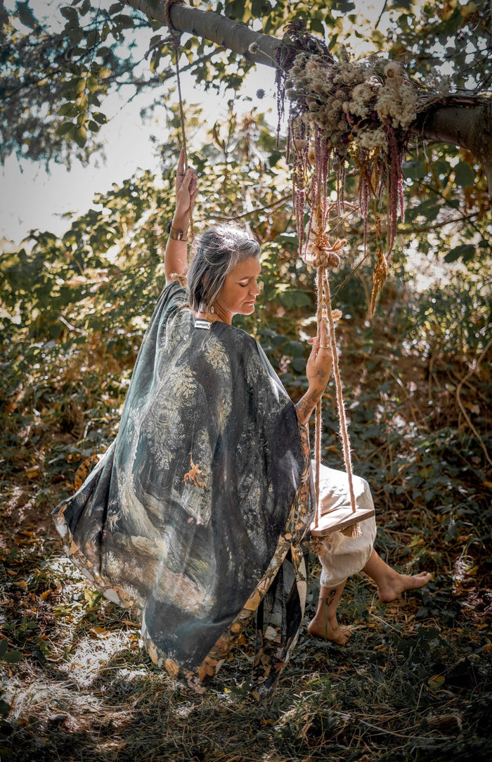 Castles in the Air Starduster kimono featuring Brueghel’s 1600s landscape, classical ruins, and joyful swing scene on bamboo-based viscose – Market of Stars.