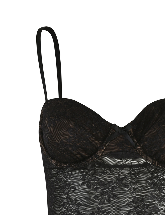 The CHARLEIGH TOP - BLACK : LACE by TIGERMIST is a black camisole with adjustable straps, underwire cups, and floral lace over nude lining for an alluring finish.