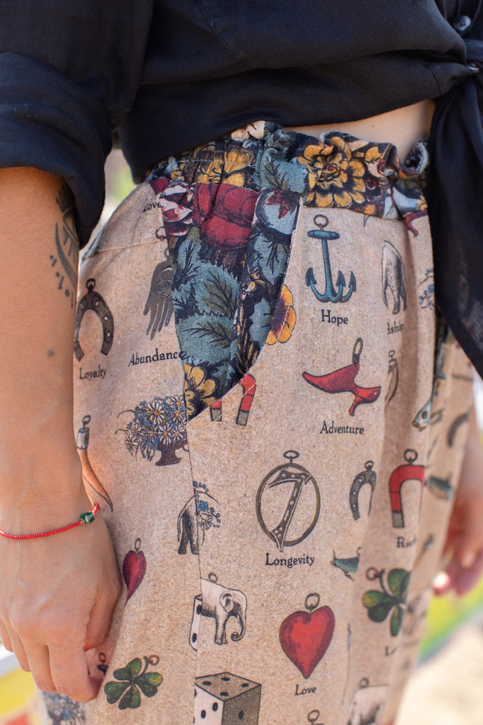 Charmed Life Artist Pants featuring playful Victorian luck charms and floral trim on breathable linen & bamboo/wood viscose – Market of Stars.