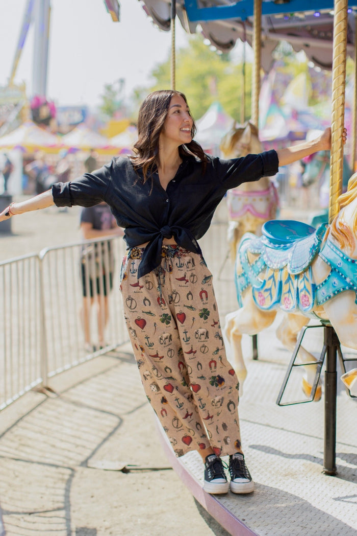 Charmed Life Artist Pants featuring playful Victorian luck charms and floral trim on breathable linen & bamboo/wood viscose – Market of Stars.