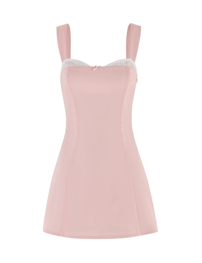 The COLSON MINI DRESS - PINK by TIGERMIST features a baby pink sleeveless design with wide straps, a fitted bodice, white lace trim at the neckline, and a delicate center front bow.