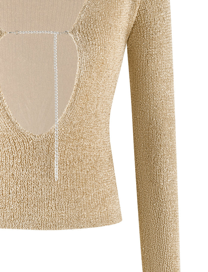 Introducing the CONNELL TOP - GOLD by TIGERMIST: This beige, long-sleeve knit top features a deep V neckline adorned with a thin string detail across the chest. The textured, ribbed fabric is accented with subtle sequin details. Designed to end at the waist, it offers a chic, cropped look.