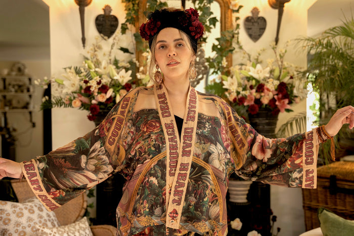 Model wearing Courage Dear Heart Pixie cut Duster featuring Victorian Sacred Heart art and hidden affirmations of courage and love on bamboo-based viscose – Market of Stars.