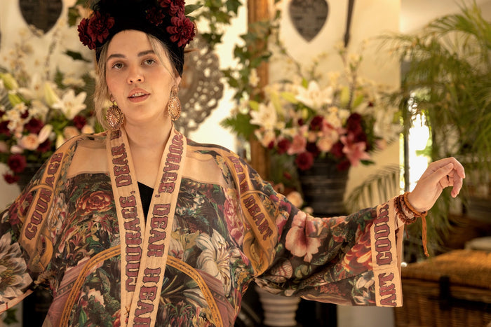 Model wearing Courage Dear Heart Pixie cut Duster featuring Victorian Sacred Heart art and hidden affirmations of courage and love on bamboo-based viscose – Market of Stars.