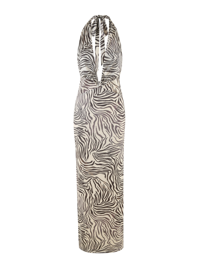 The TIGERMIST CRESSIDA DRESS - NEUTRAL : ZEBRA is a sleeveless maxi halter dress with a plunging neckline and an eye-catching black and white zebra print.