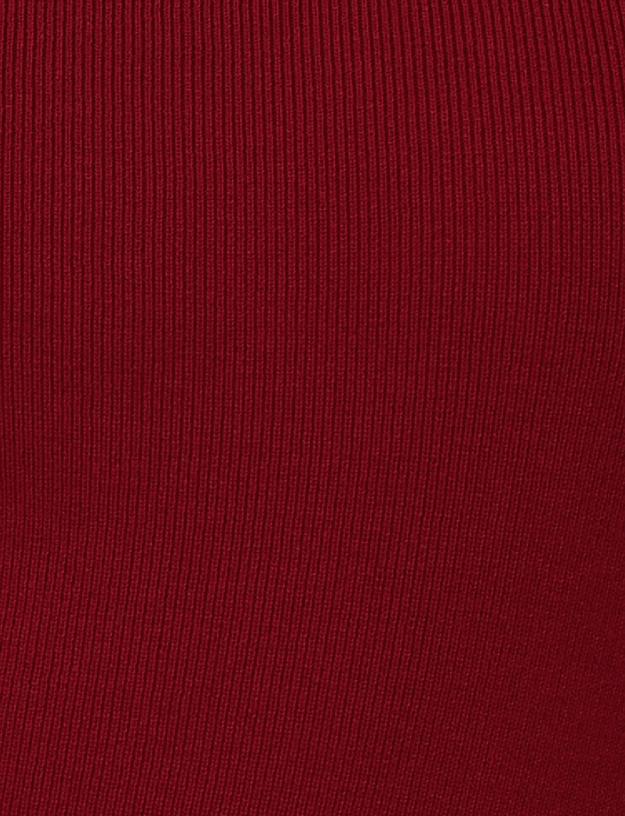 Close-up of red ribbed fabric in the "Wine" colourway, highlighting vertical texture lines from TIGERMIST’s CYPRESS MINI DRESS – RED : WINE.