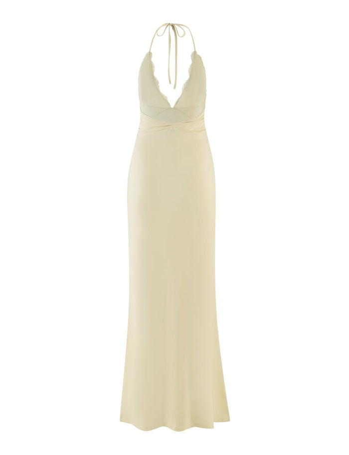The DEENA MAXI DRESS - YELLOW : LEMON by TIGERMIST is a full-length halter design in a soft yellow shade, featuring delicate lace bust cups and a deep V-neckline, with a tie elegantly securing at the back. Its fitted bodice smoothly transitions into a slightly flared maxi hem.