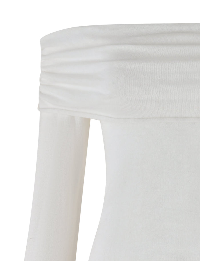 The DIEDRE JUMPER - WHITE : CREAM from TIGERMIST is highlighted, emphasizing its off-the-shoulder white neckline. The jumper dress includes a ruched, fold-over detail at the neckline and has long sleeves. Made from high stretch fabric, the material feels soft and lightweight.