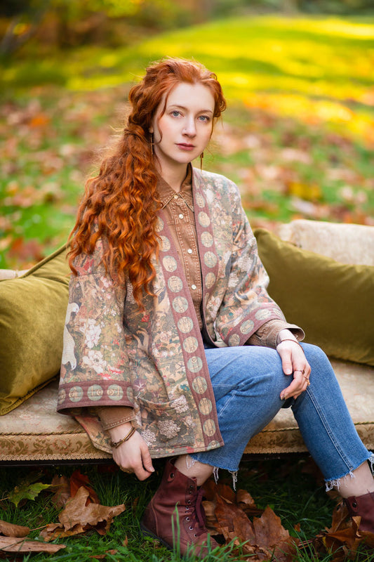 Model wearing Dreamweaver Cottage Cardigan featuring Mucha’s 1896 zodiac woman with celestial crown, printed on cozy fleece-lined cotton blend – Market of Stars