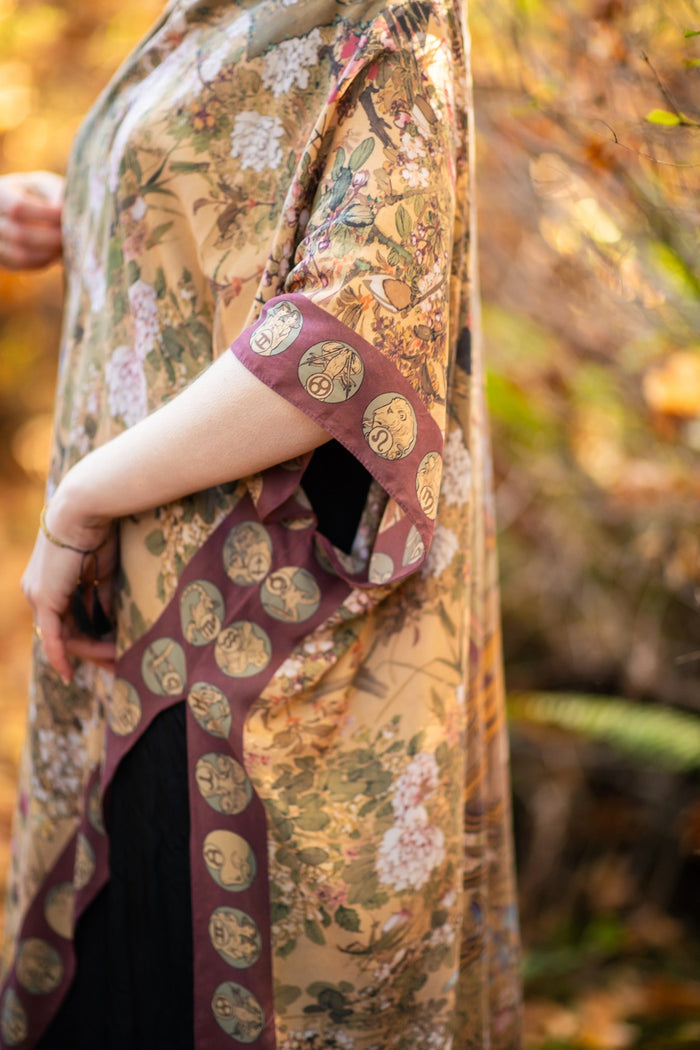 Dreamweaver Goddess Duster featuring Alphonse Mucha’s 1896 zodiac woman, celestial crown, and burgundy zodiac trim inspired by vintage bohemian style – Market of Stars
