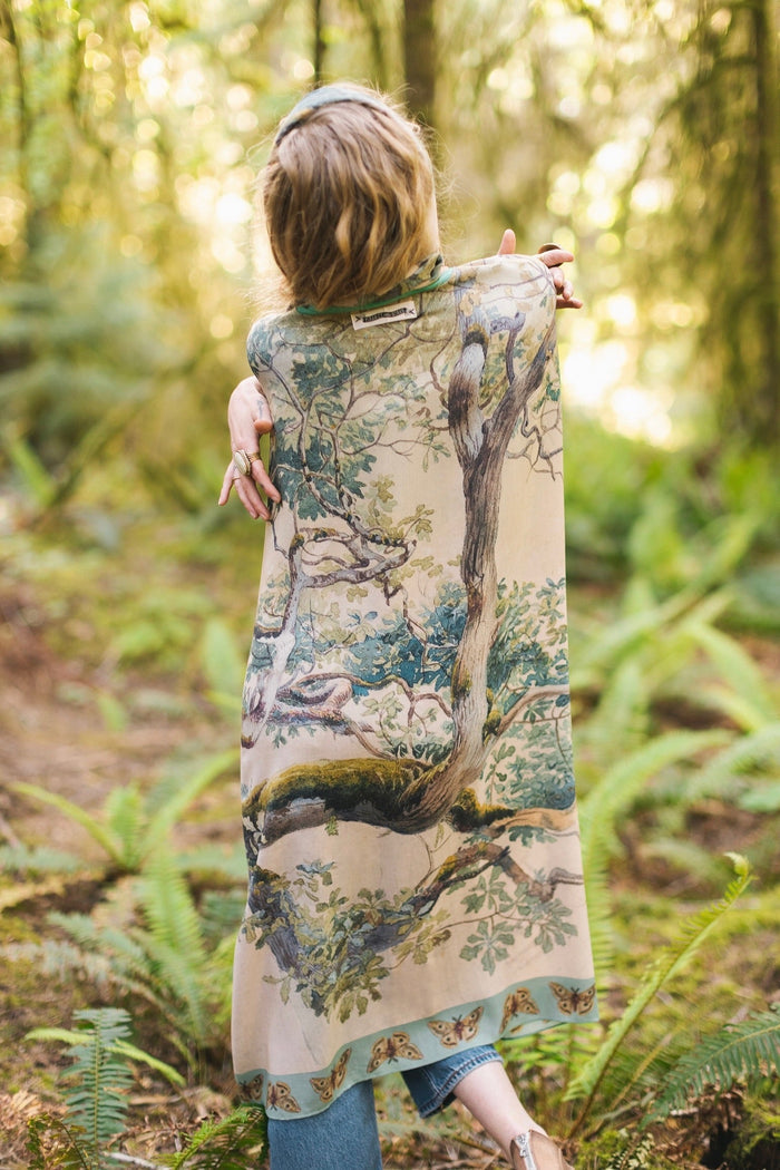 Model wearing the Earth and Sky Goddess length kimono featuring majestic trees by Charles Aston and antique moth illustrations – a dreamy tribute to nature – Market of Stars.