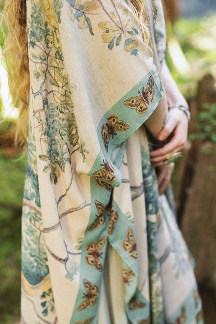 Model wearing the Earth and Sky Goddess length kimono featuring majestic trees by Charles Aston and antique moth illustrations – a dreamy tribute to nature – Market of Stars.