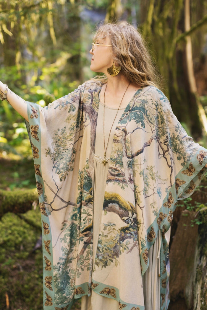 Model wearing the Earth and Sky Goddess length kimono featuring majestic trees by Charles Aston and antique moth illustrations – a dreamy tribute to nature – Market of Stars.