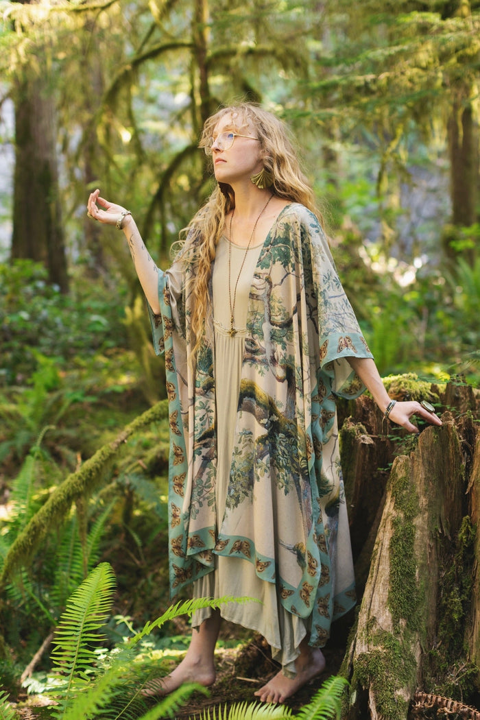 Model wearing the Earth and Sky Goddess length kimono featuring majestic trees by Charles Aston and antique moth illustrations – a dreamy tribute to nature – Market of Stars.