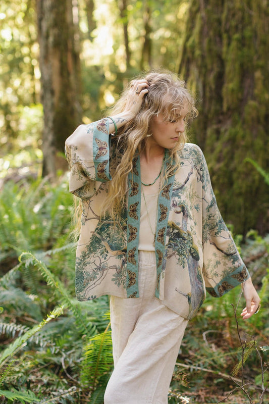 Model wearing Earth and Sky Pixie Duster featuring Charles Aston’s tree art and antique moth illustrations – a soft, nature-inspired layering piece – Market of Stars.