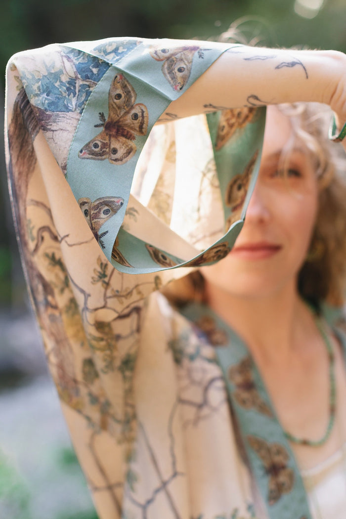 Model wearing Earth and Sky Pixie Duster featuring Charles Aston’s tree art and antique moth illustrations – a soft, nature-inspired layering piece – Market of Stars.