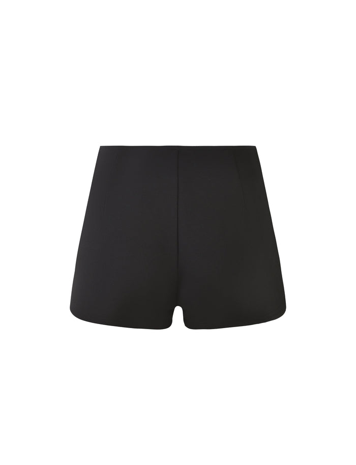 Introducing the ELERI SHORT - BLACK by TIGERMIST. These high-waisted black micro shorts boast a sleek bodycon silhouette with a minimalist design, free of visible patterns or embellishments. They offer a snug fit that tapers slightly around the leg openings. The ELERI SHORT - BLACK is showcased against a plain white background.