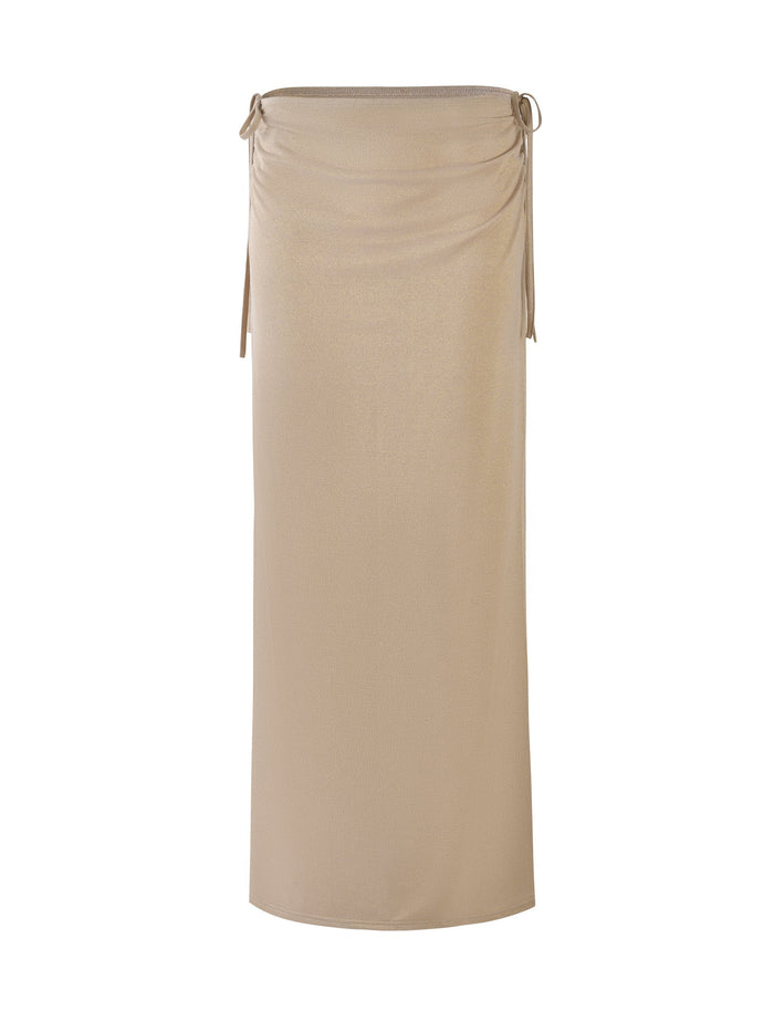 Introducing the ELLIANA SKIRT by Tigermist, a gold, high-waisted, midi-length skirt featuring an elastic waistband and adjustable side drawstrings for a gathered effect. The fabric is smooth and slightly shiny, giving it a sleek and elegant appearance. The minimalist design is free from visible patterns or embellishments.